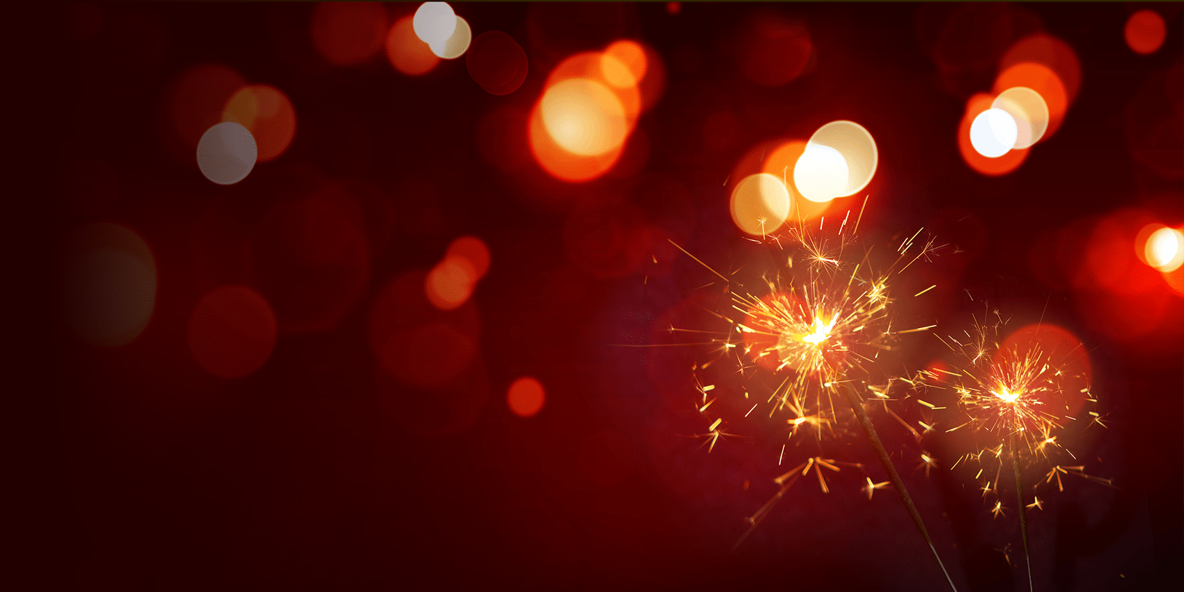 Sparkler with blurred warm tones bokeh background